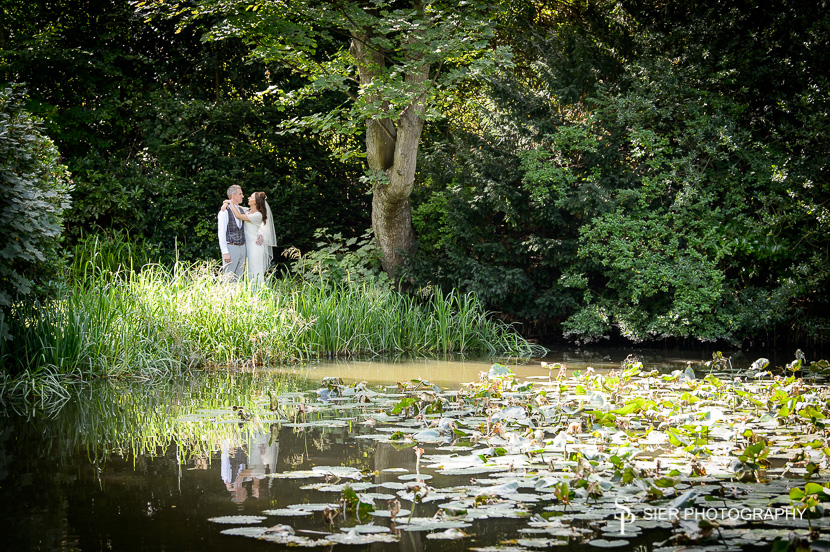 Wonderful wedding at the magnificent Kenwood Hall in Sheffield. Our couple are seen together from across the lake.
