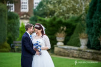 Wonderful summer wedding as our happy couple stand in the grounds of the magnificent Whitley Hall Hotel
